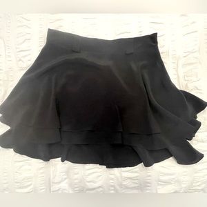 Black 100% silk Yumi Kim tiered mini skirt.